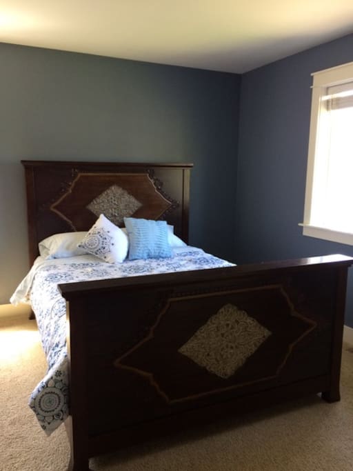 The master bedroom, with Queen bed, full bath, walk-in closet and additional bonus room.