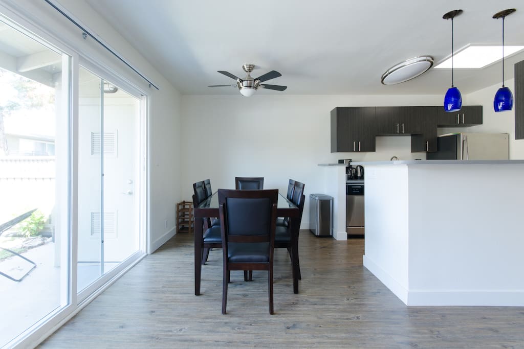 Glass dining table with six chairs