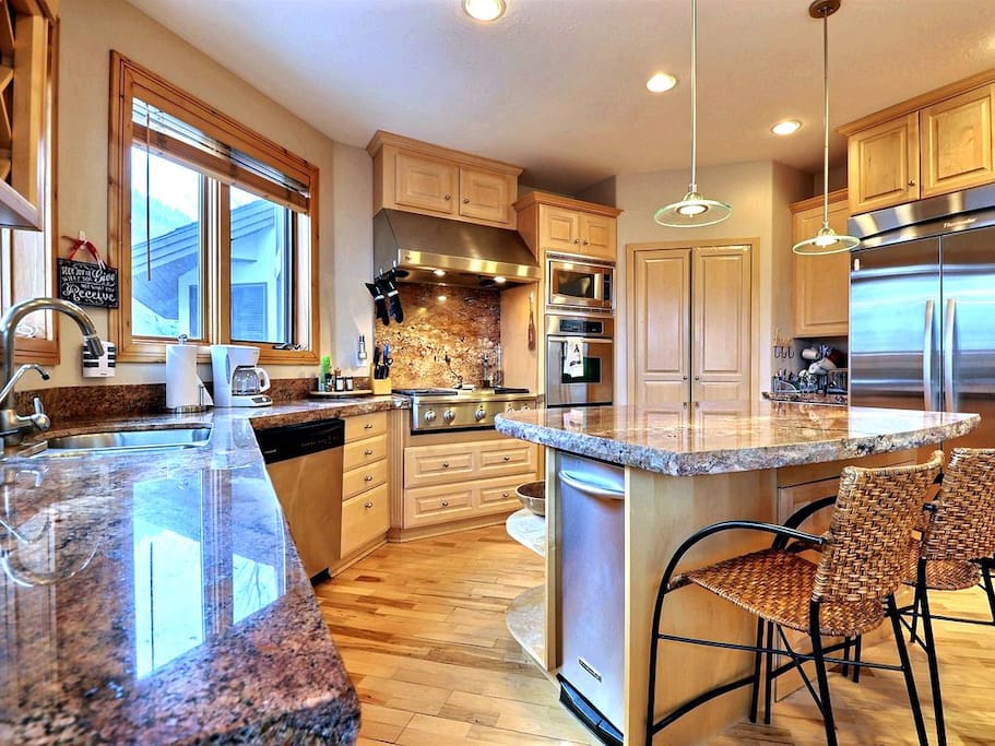 Remodeled Kitchen with Granite Counter-tops and Stainless Steel Appliances