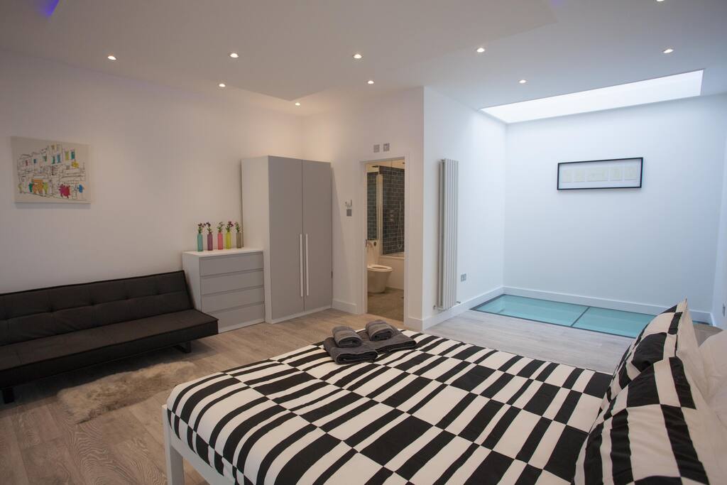 Master bedroom with en-suite bathroom and sofabed