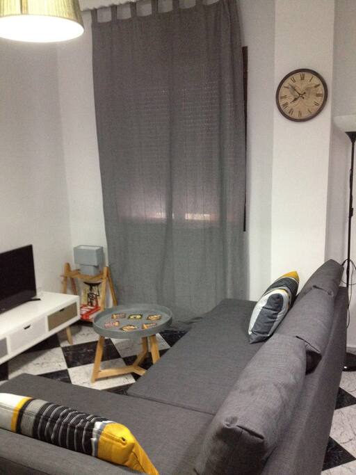 Salón con sofá cama doble