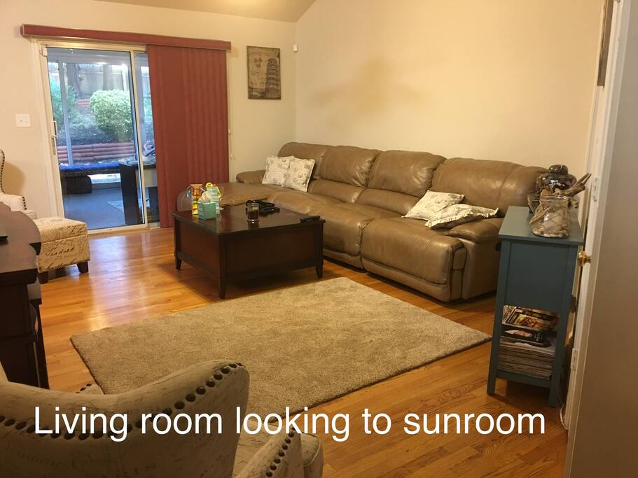 Living room with leather couch. Chaise lounge an one end and two recline sections. The end unit is a power recliner. Supreme comfort!! Two wing back chairs for your comfort are not fully shown in the picture.