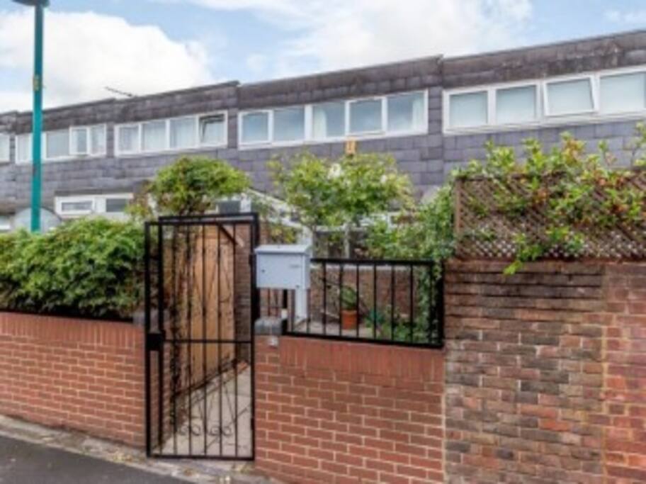 Nice secure gated front garden with space for bikes to park and roses around the gate!