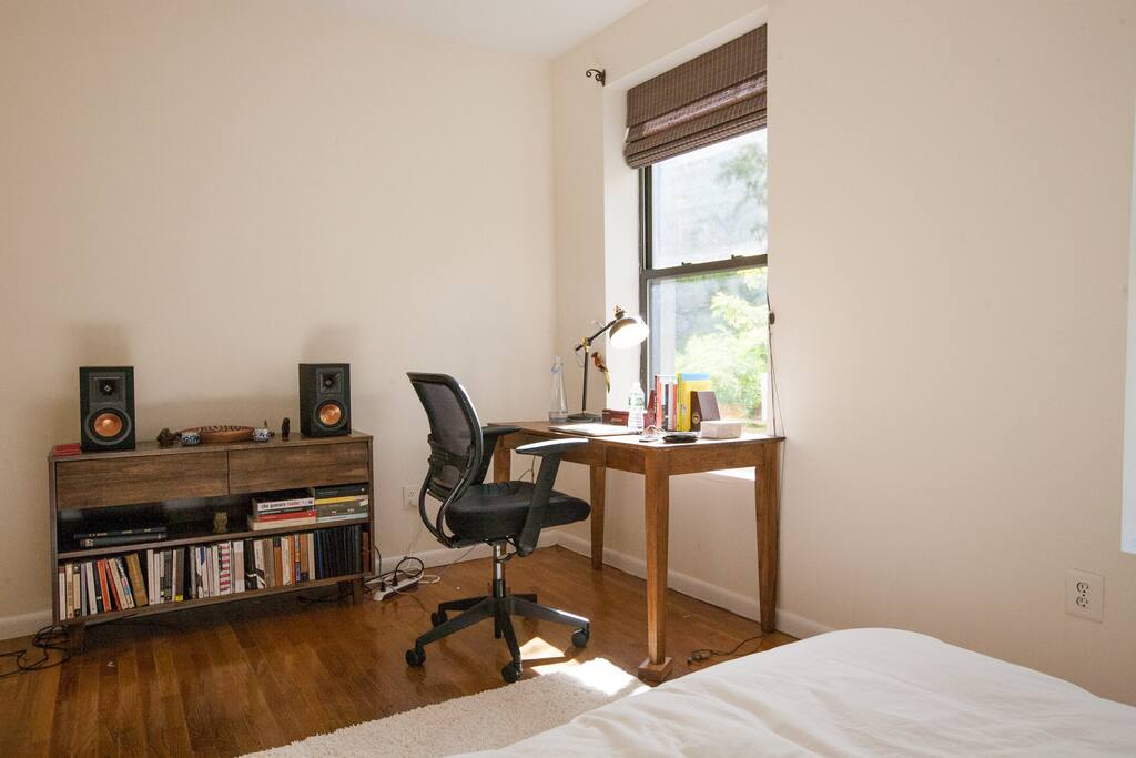 The work station as seen from the bed, for writing, reading and studying