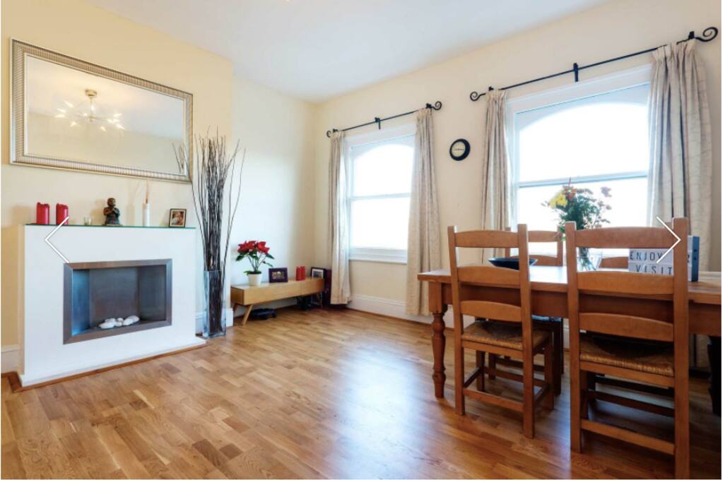 Spacious living room with faux fire place