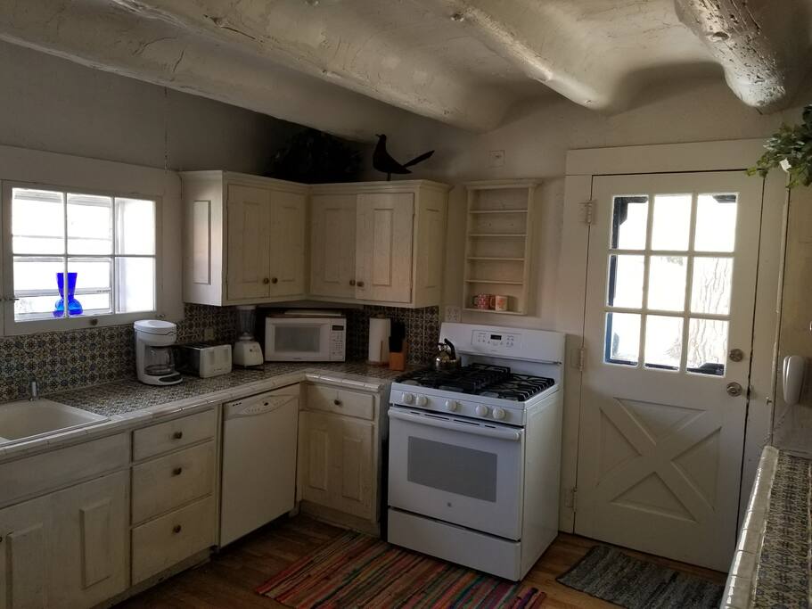 Kitchen stocked with basic cooking supplies and utensils