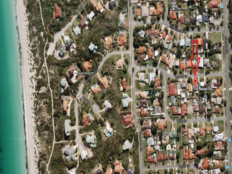 An aerial view displays the residential area surrounding the property, highlighting the proximity to Warnbro Sound beach. The layout includes tree-lined streets, demonstrating a tranquil neighborhood setting, with the location marked clearly for easy navigation.