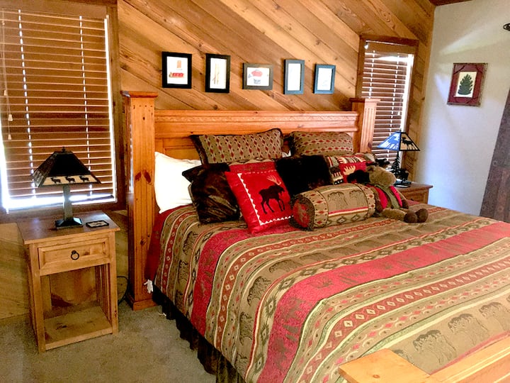 Bedroom #1 with California King Size Bed with bed warmers, private bathroom, and vaulted ceilings. 