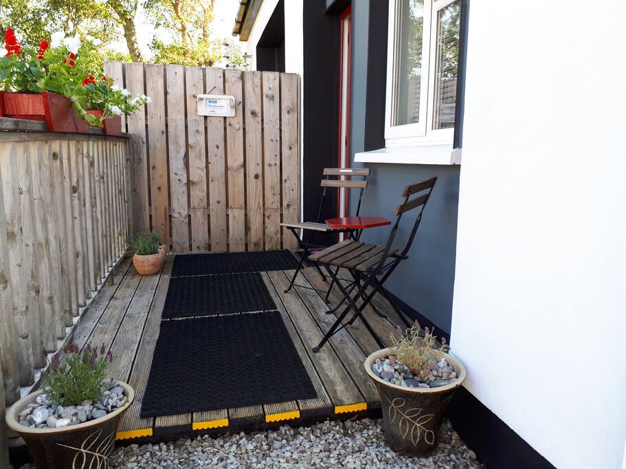Your own front door. Small wooden deck. “Do not be put off by this being a converted garage. It is modern and exceptionally well equipped” (Ron & Marie, NI).