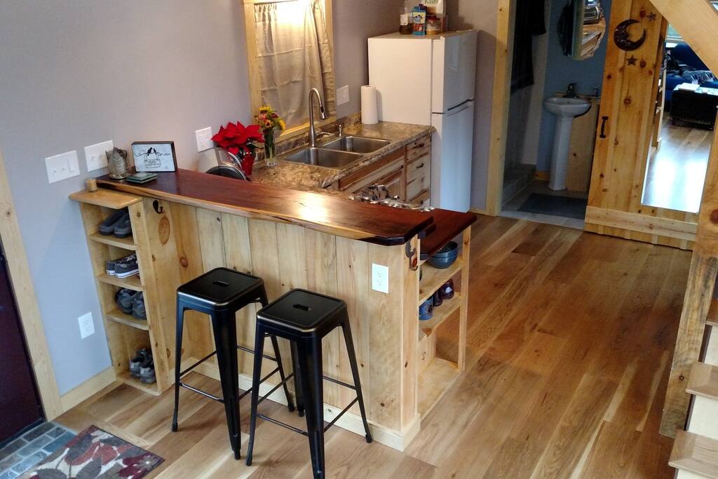 Kitchen with coffee maker, Starbucks coffee, microwave, toaster oven and hot plate.