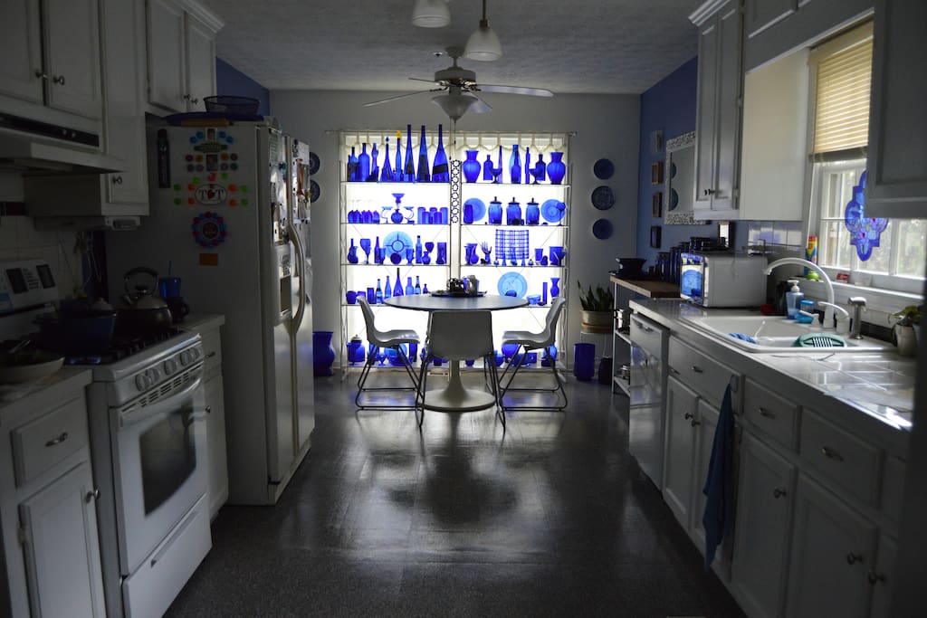 Kitchen and breakfast nook. It looks so beautiful when the sun shines through the cobalt glass!