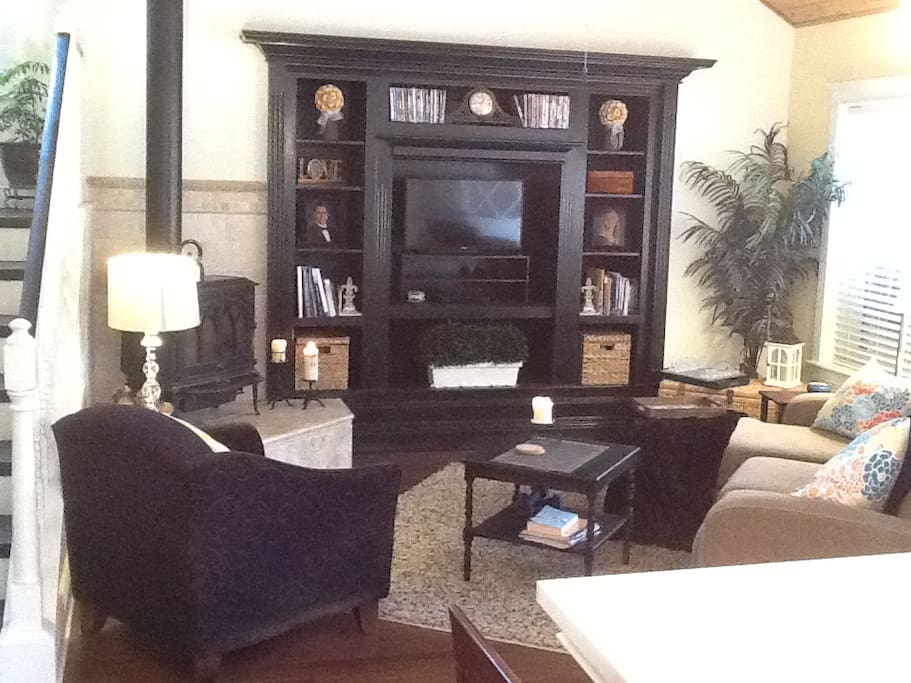 Living room with boards games and movies.