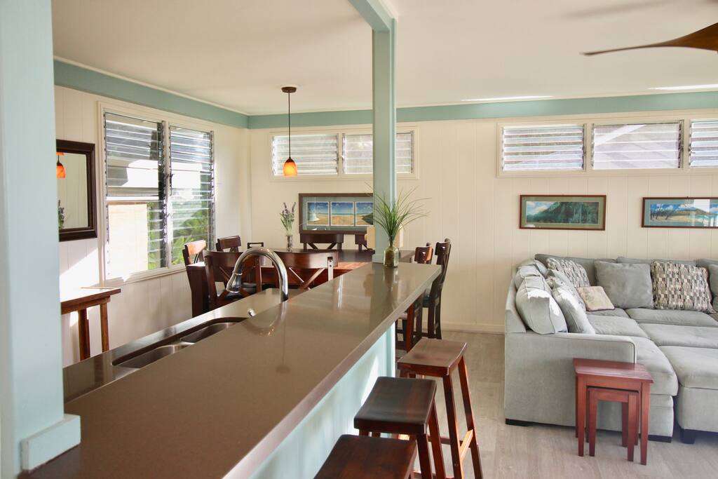 Additional stool seating (4 stools) at kitchen bar counter.