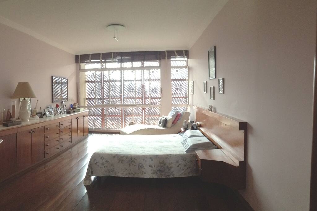 main bedroom - the furniture hides 2 retractable tables where you can work with you notebook.