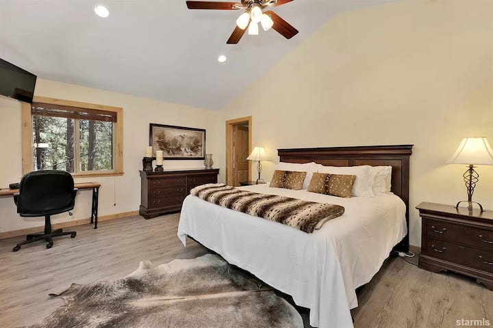 Master bedroom King-sized bed and workspace desk for WFH or school