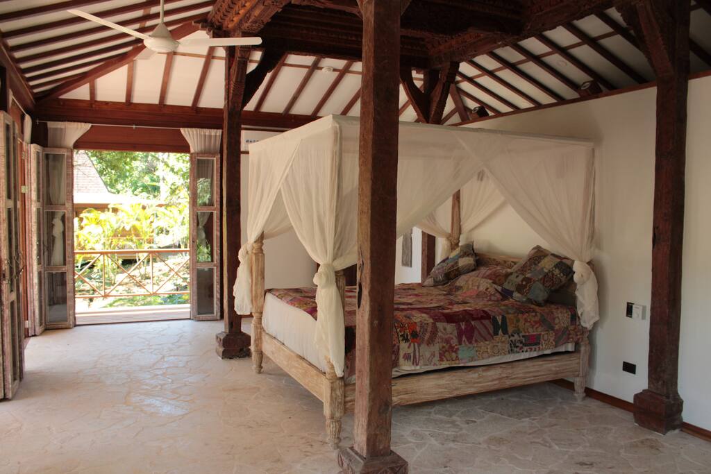 A queen size bed under a 150 year old wood carved ceiling makes sure you feel like a king/queen.