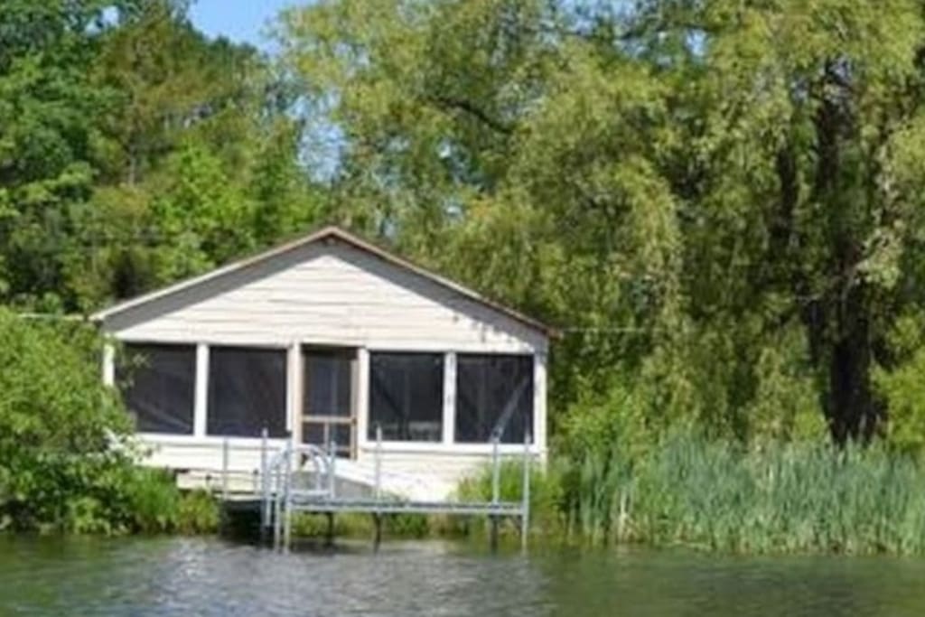 Close to the waterfront with a screen in porch overlooking Cedar Lake with the Monkton Ridge in the background.