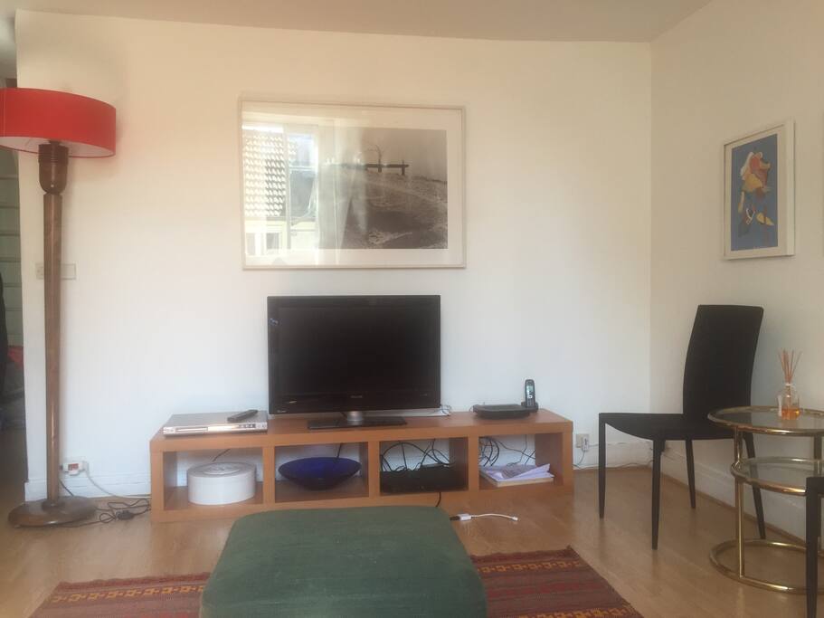 Spacious living room with a tv