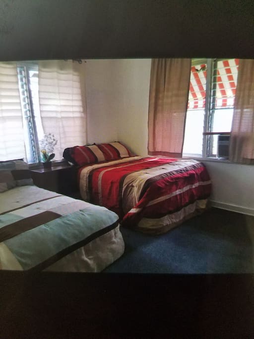 two cozy beds with air conditioning