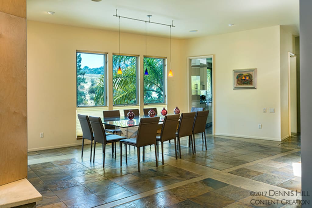 Main living room + main dining room area. Kitchen entrance.