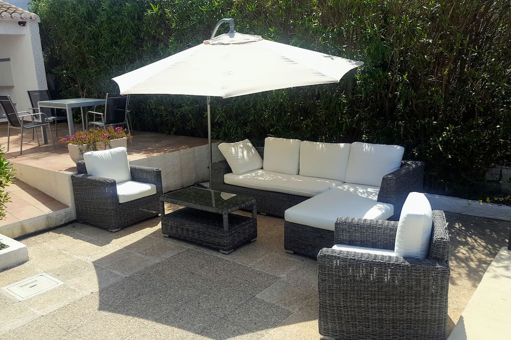 Take a comfortable seat next to the pool and BBQ area.