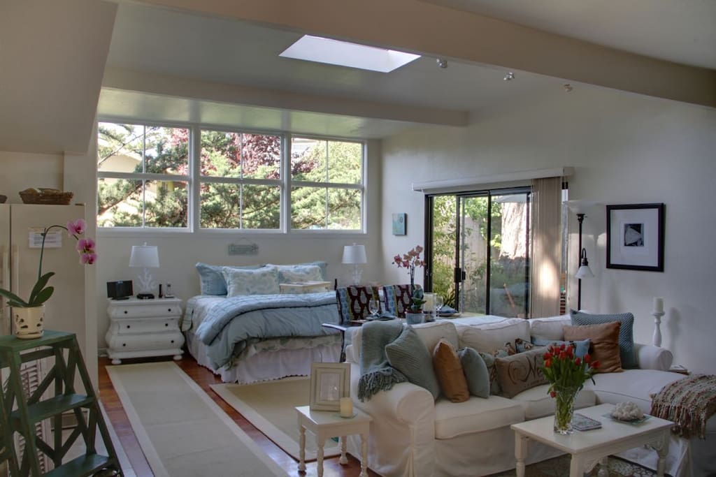 Sliding doors lead to your enclosed private deck with gas grill for outdoor dining.