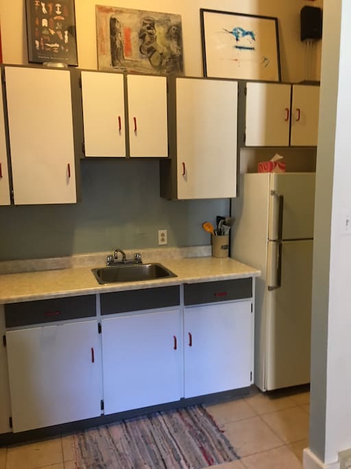 One chef kitchen with original art.