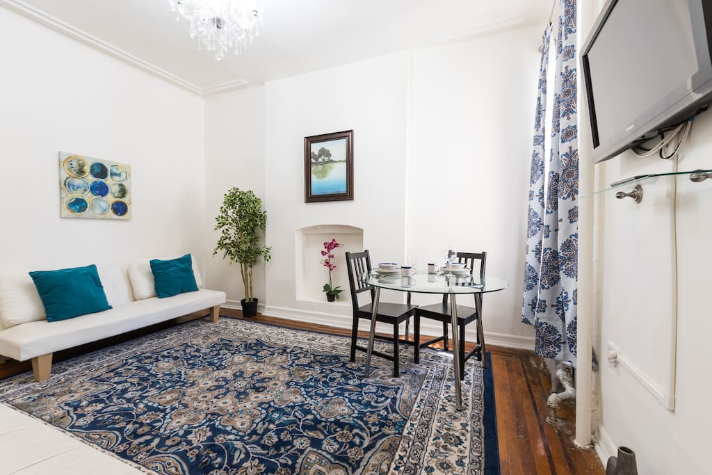 Large living room space with dining set for 4.