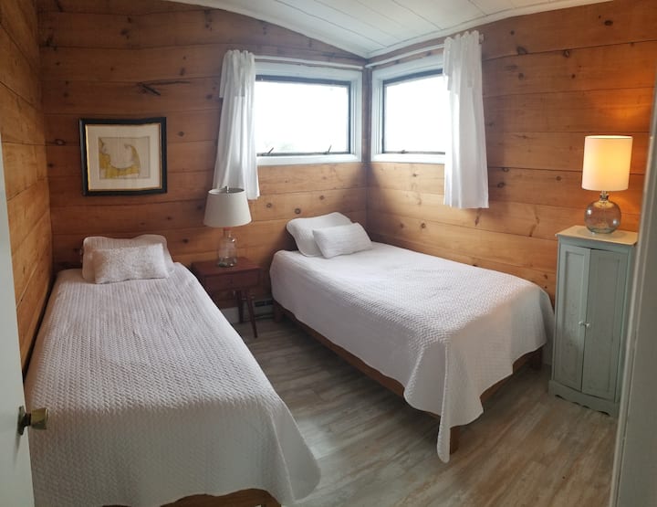 Second bedroom on main level has two twin beds that convert to a king.