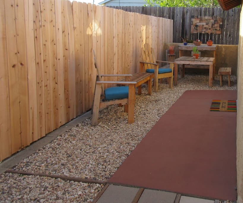 Cozy outdoor seating area with picnic table. All handmade of reclaimed pallet wood. Enjoy a cool drink or a meal here after a day at one of the local beaches.