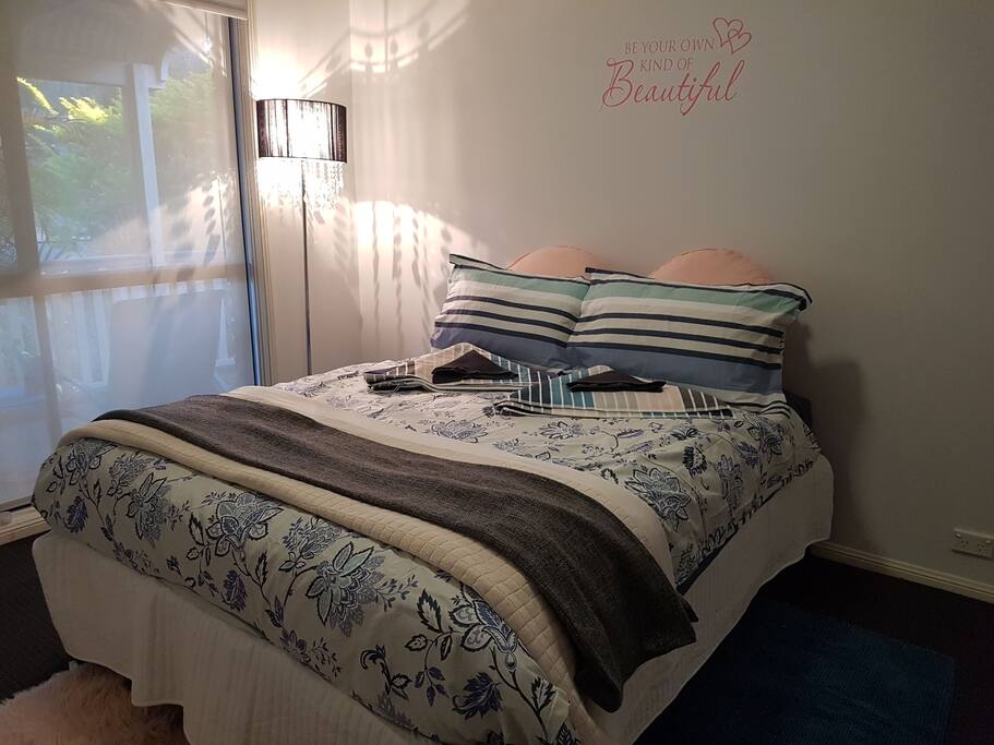 Master bedroom with air con, overhead fan, walk in robe and adjoining bathroom