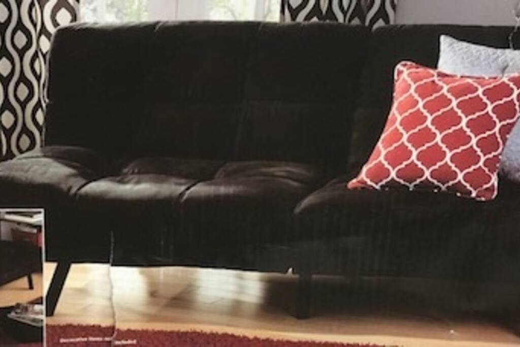 Sofa/Bed for washing TV or lounging.