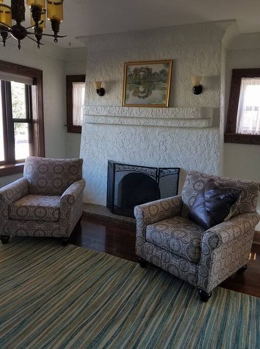 A fireplace in the front room