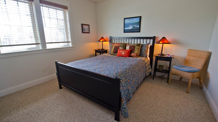 Cozy queen bed in bedroom on the level with the kitchen, living room and bathroom.