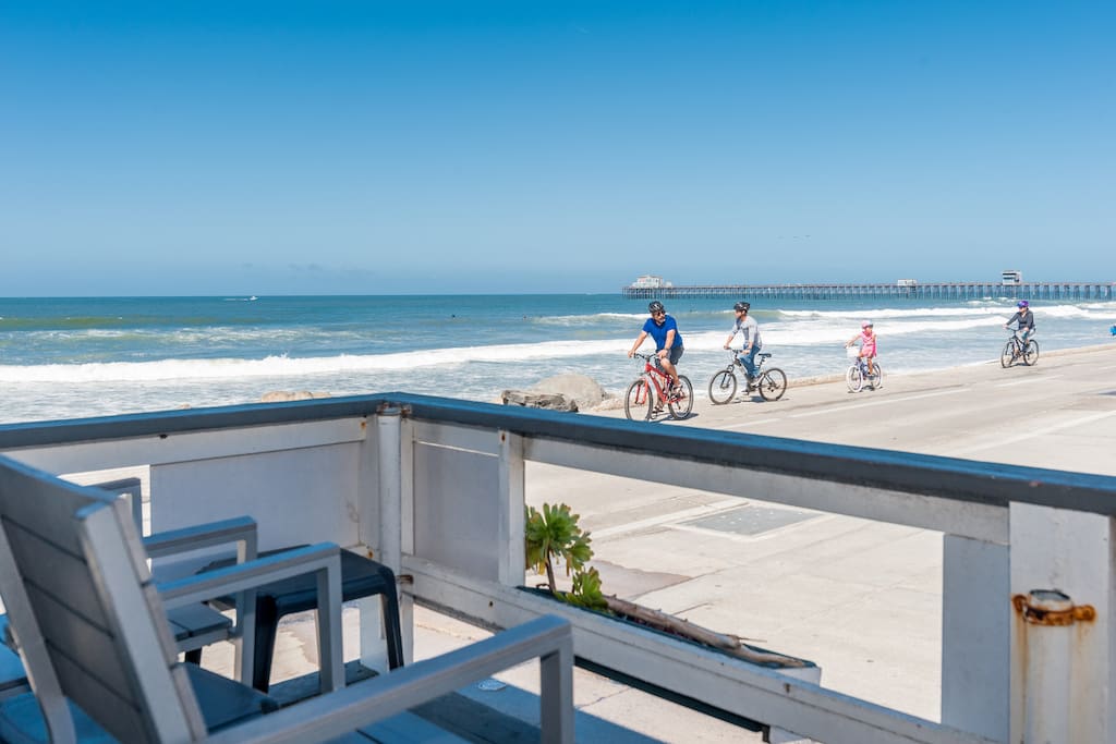 Attached deck with chairs & table. View to the pier.