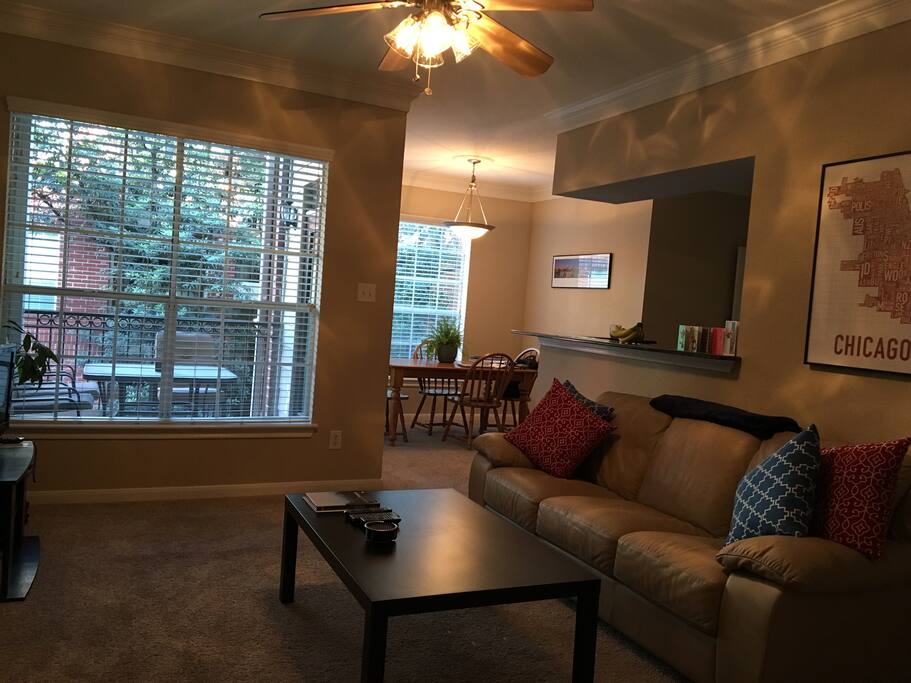 Open, sunny living room with a comfortable couch