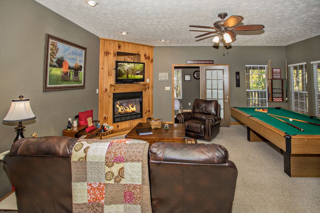 Living space with reclining sofa and captain chair. Stay a while and relax.