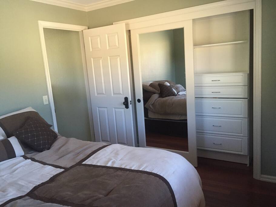 Comfy new bed awaits. Closet with drawers and hanging space.