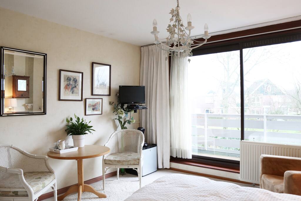 Bedroom 1 has a balcony with view on the garden
