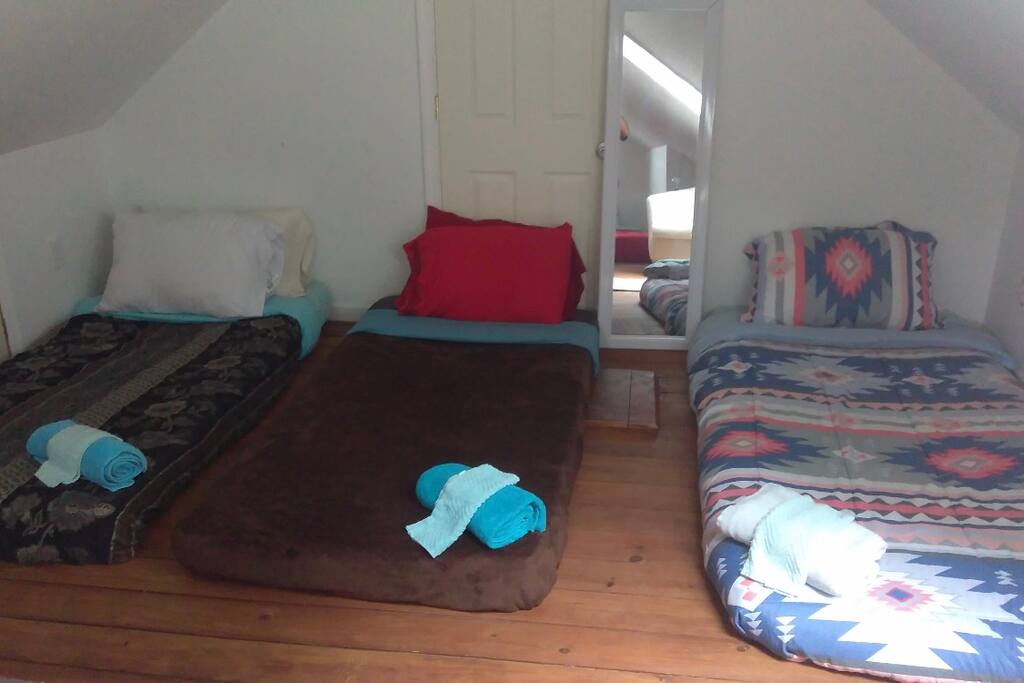 3 super thin mattresses on other side of stairwell. Perfect for kids or small adults
