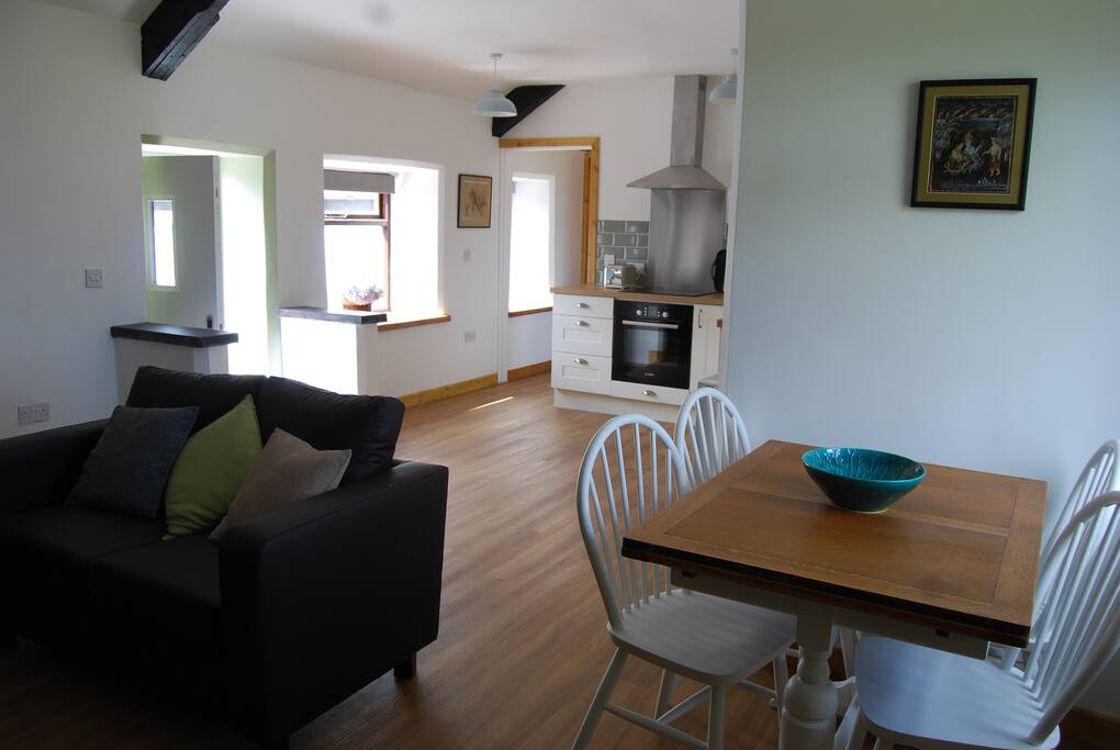 Open plan living, dining and kitchen with lots of windows