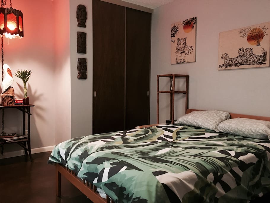 Guest bedroom has a full size bed. Bathroom is in the hallway