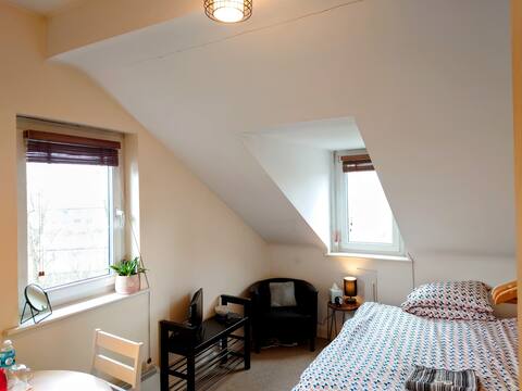 Cosy double bed in a top floor apartment.