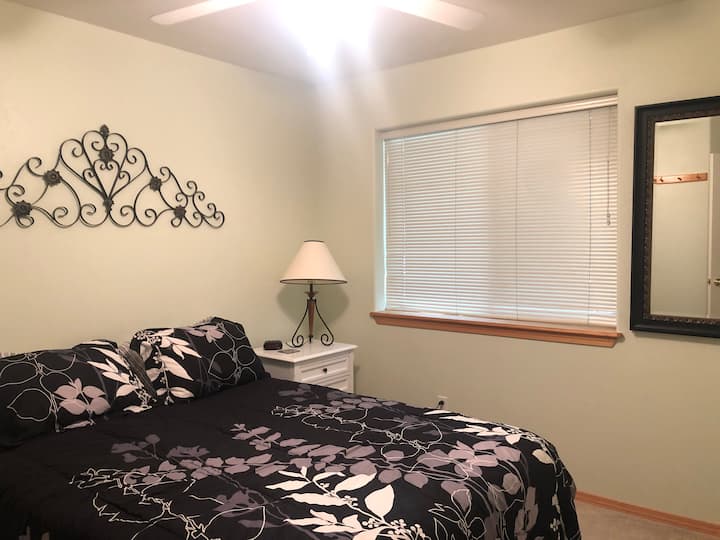 The first guest room upstairs. Has a Queen bed, full size closet, and right next to the full bathroom. 