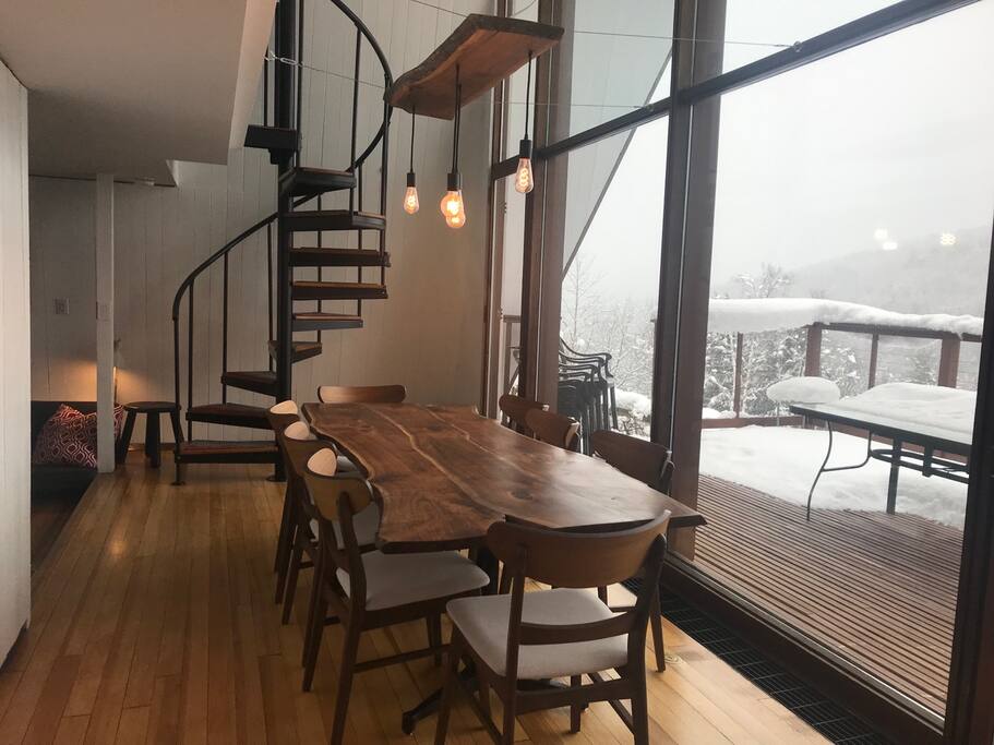 Dining room seats eight at the custom, live edge black walnut table.