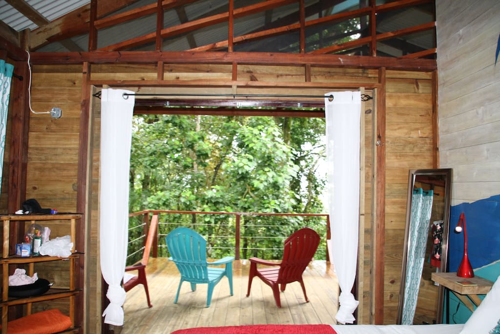 View out of the 4 paned glass doors onto your outdoor seating area.