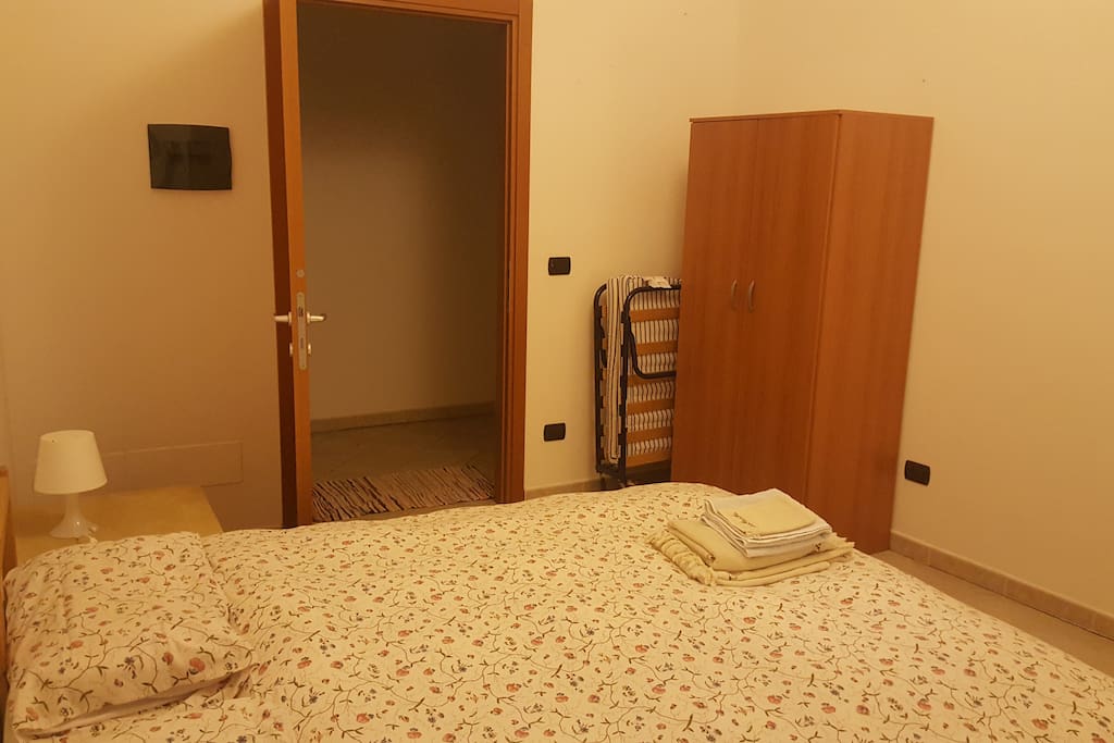 The room is located on the ground floor and equipped with a dresser, table, two chairs, double bed and even a extra bed if there is a child or third person. The bathroom is right across the hall.