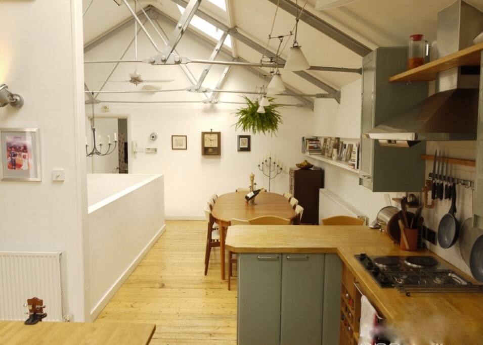 Open-plan loft: kitchen, diner (table seats 8-12), skylights, roof-terrace