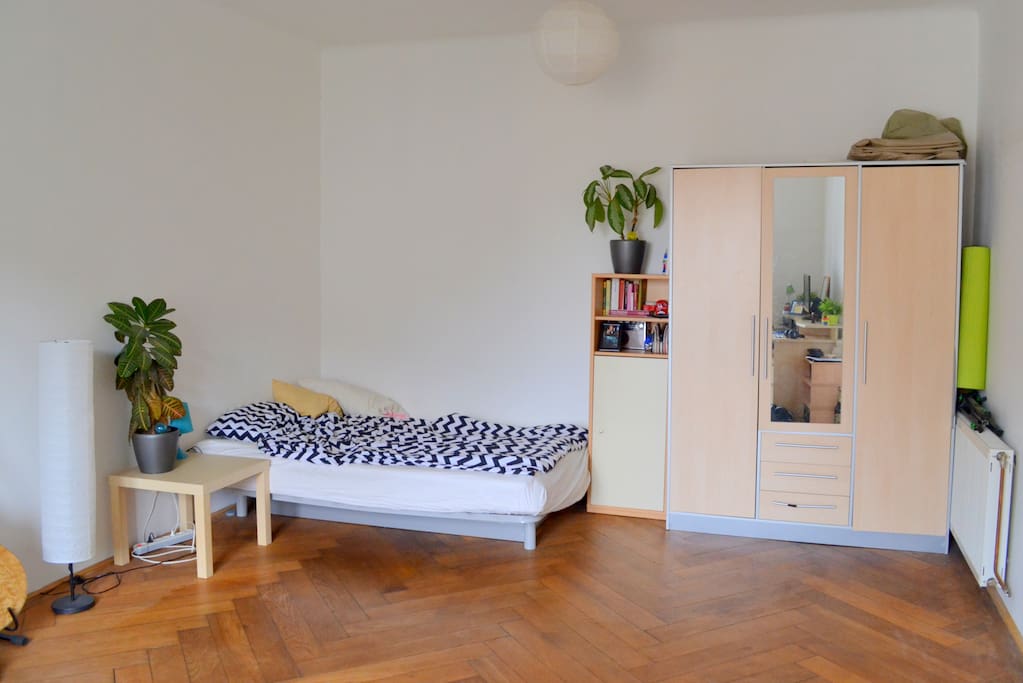 Sleeping area of the room with a double bed