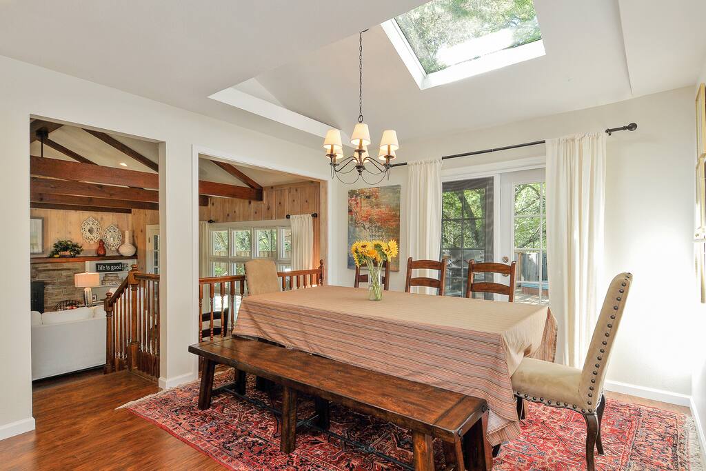 A generous indoor dining for a party of 8 near the kitchen.